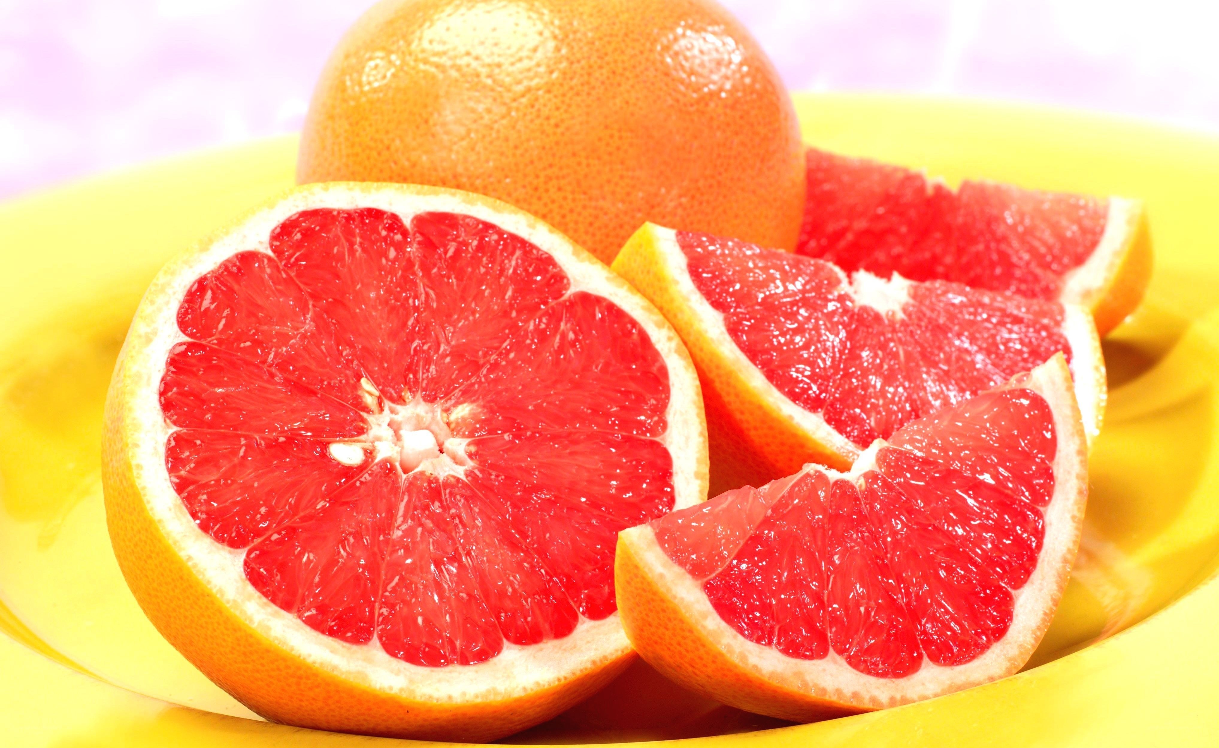 Fresh grapefruit slices on a plate