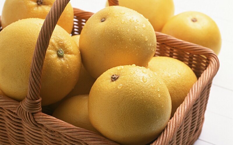 Fresh grapefruits in a basket