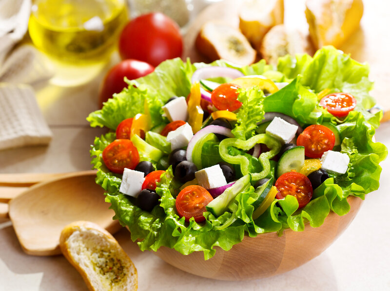 Fresh Greek salad in wooden bowl