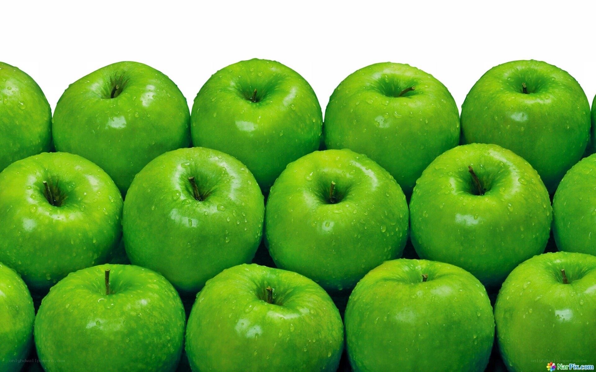 Fresh green apples with water droplets