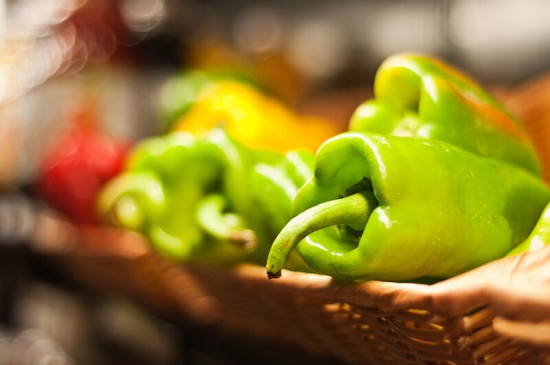 Fresh green peppers in a basket