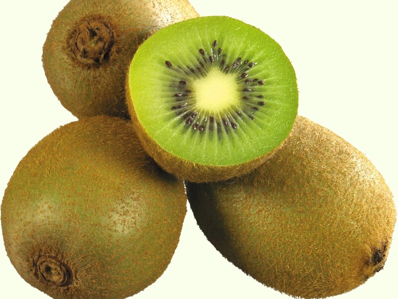 Fresh kiwi fruits with one sliced