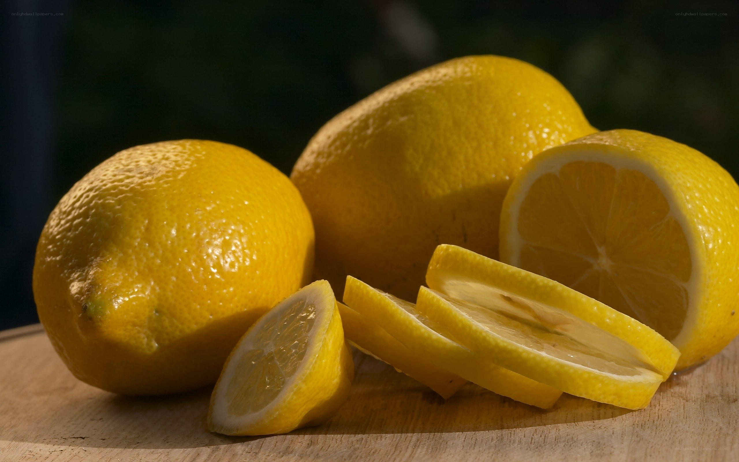 Fresh lemons on a wooden surface