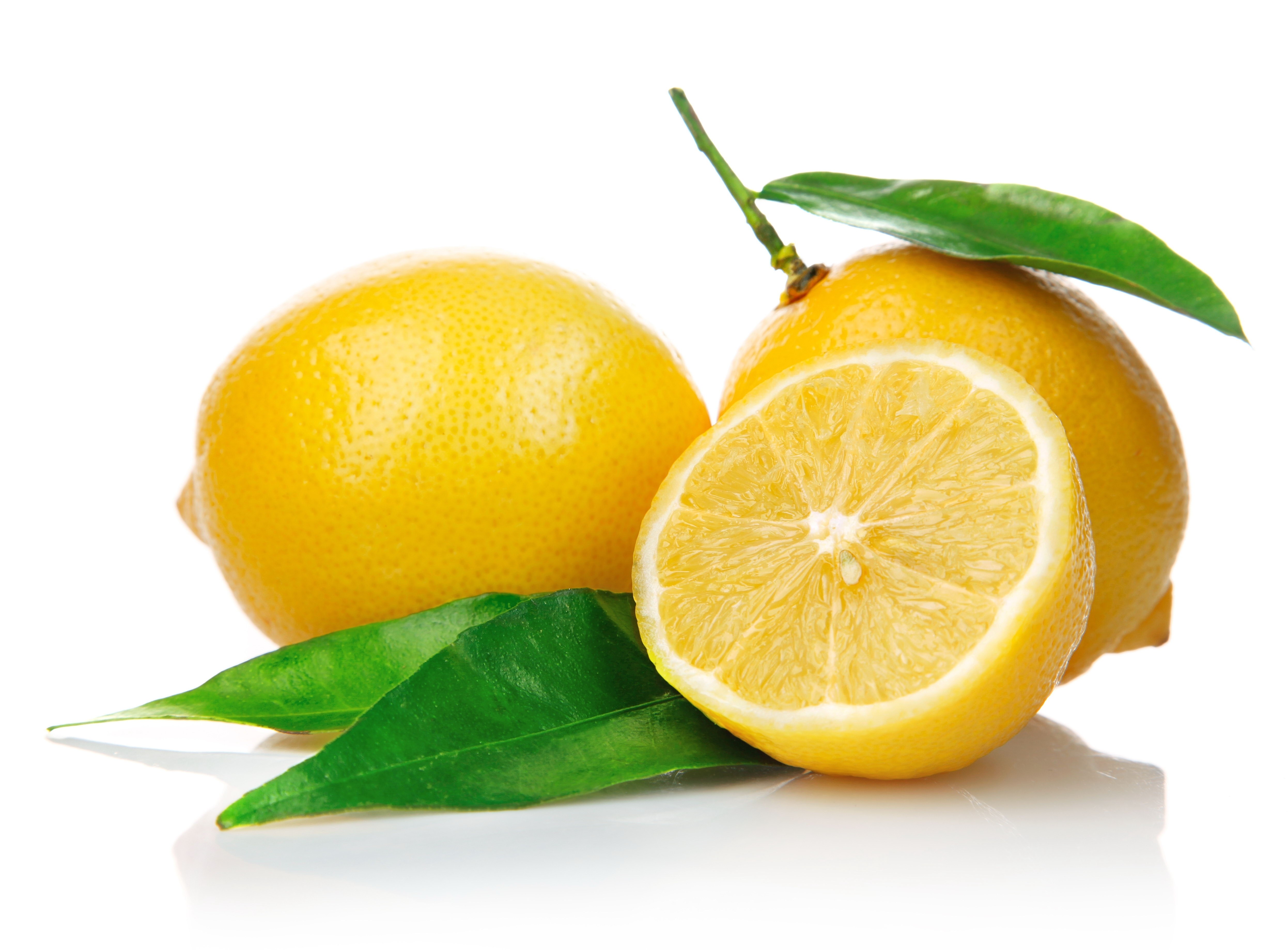 Fresh lemons with green leaves