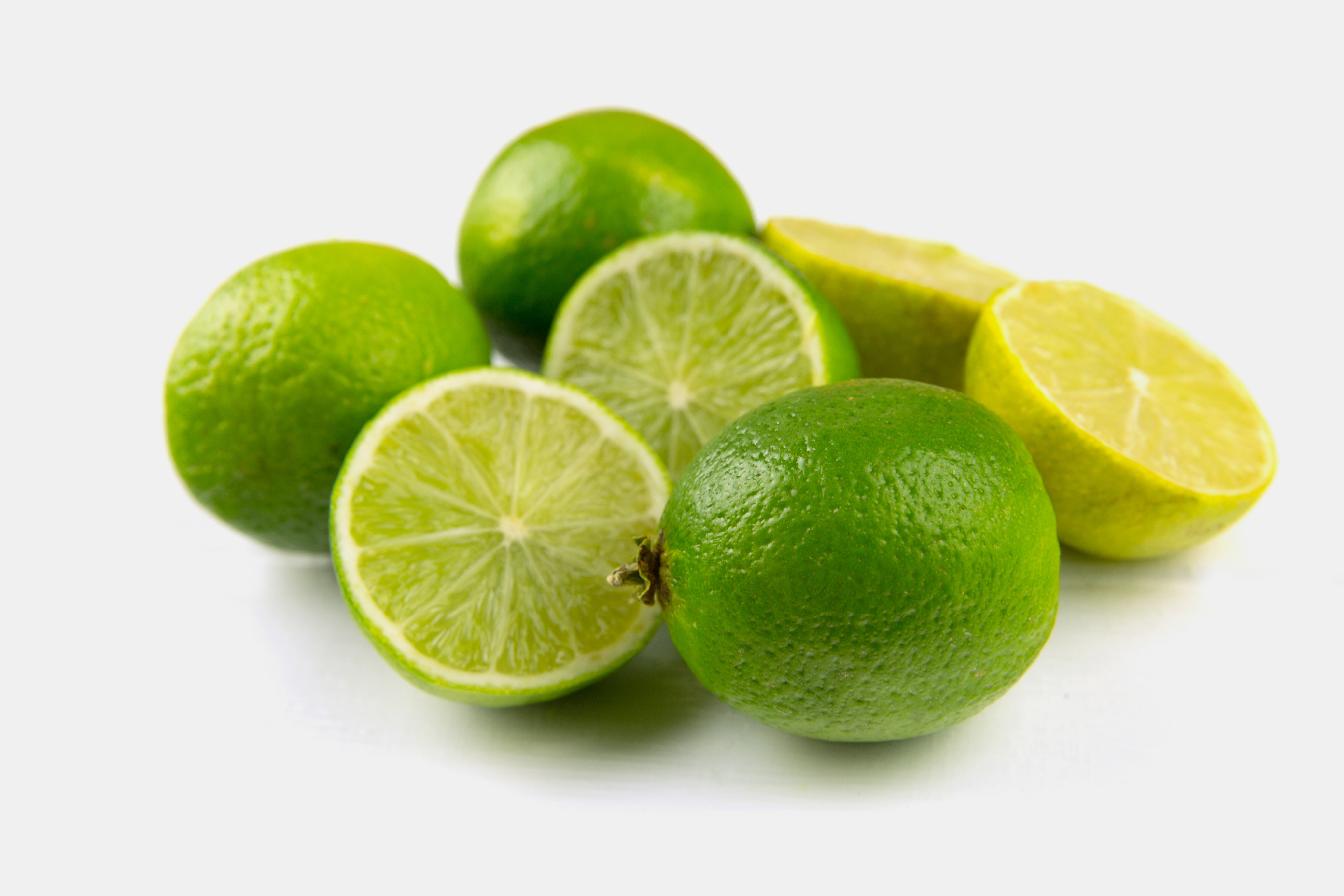 Fresh limes on white background