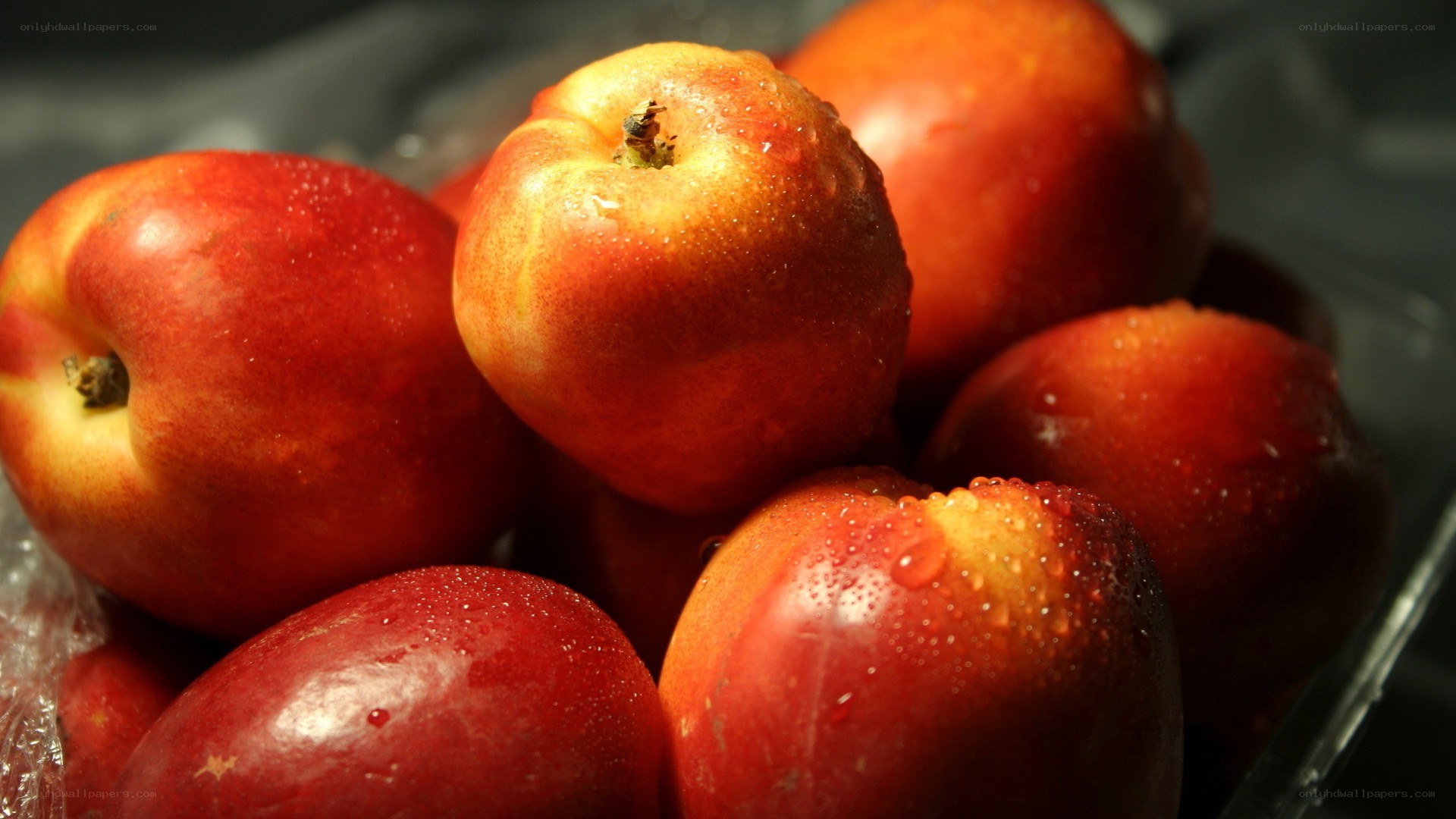 Fresh nectarines with water droplets