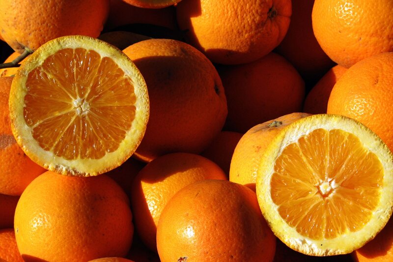 Fresh oranges in sunlight