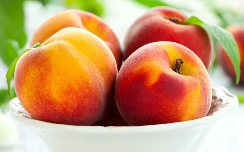 Fresh peaches in a bowl