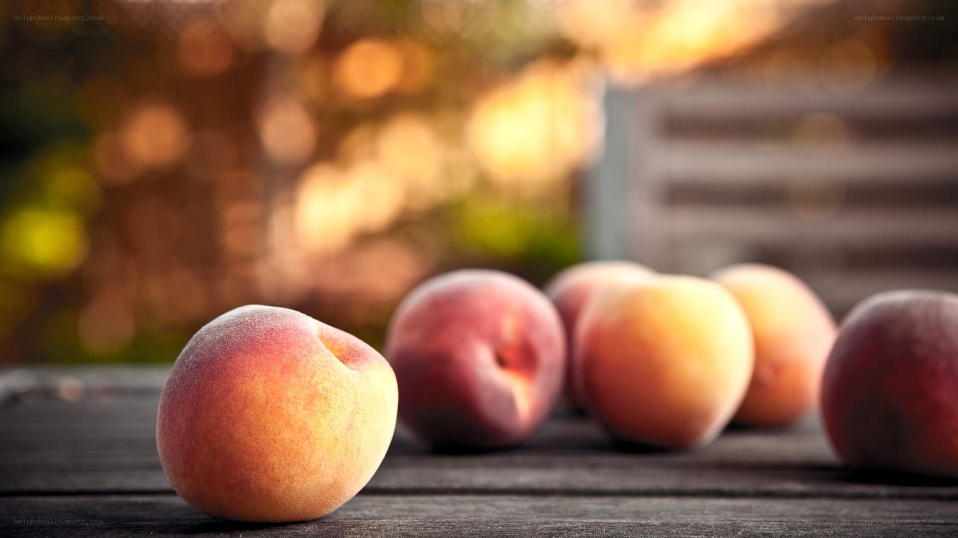 Fresh peaches on a wooden table