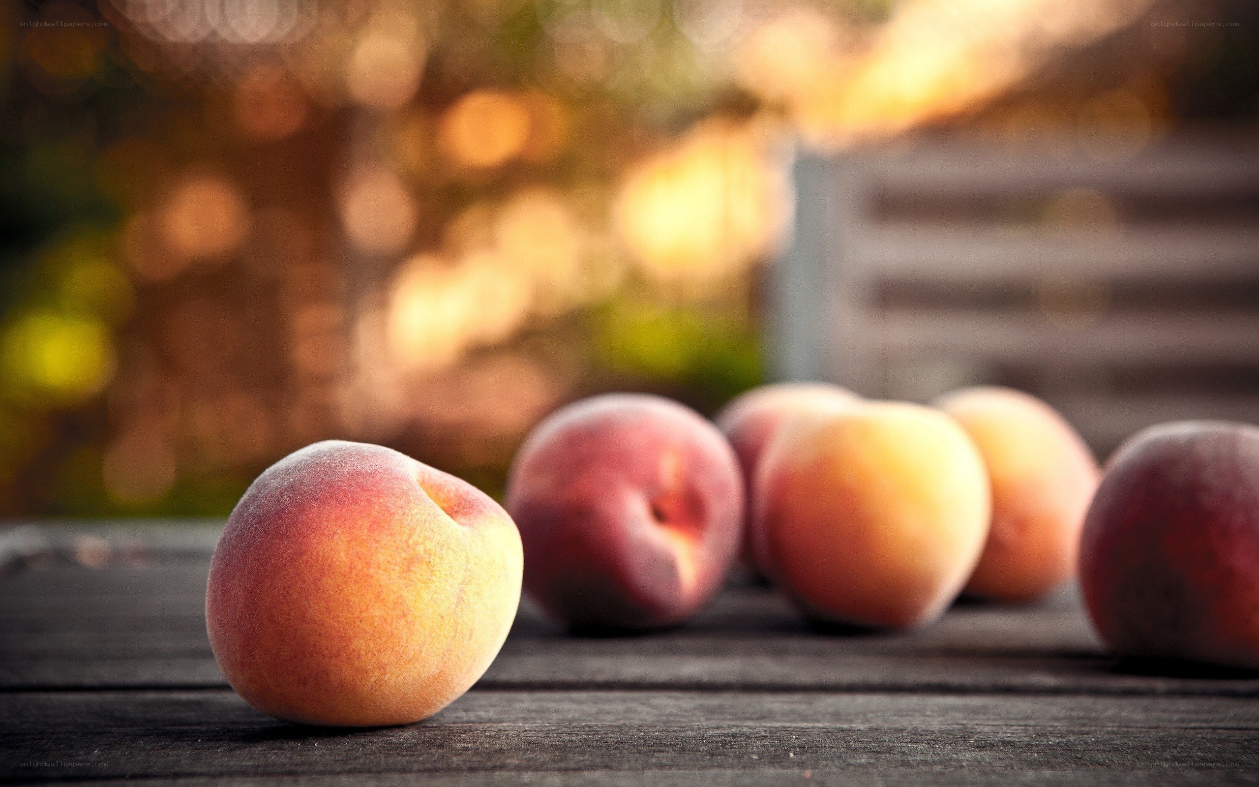 Fresh peaches on wooden table