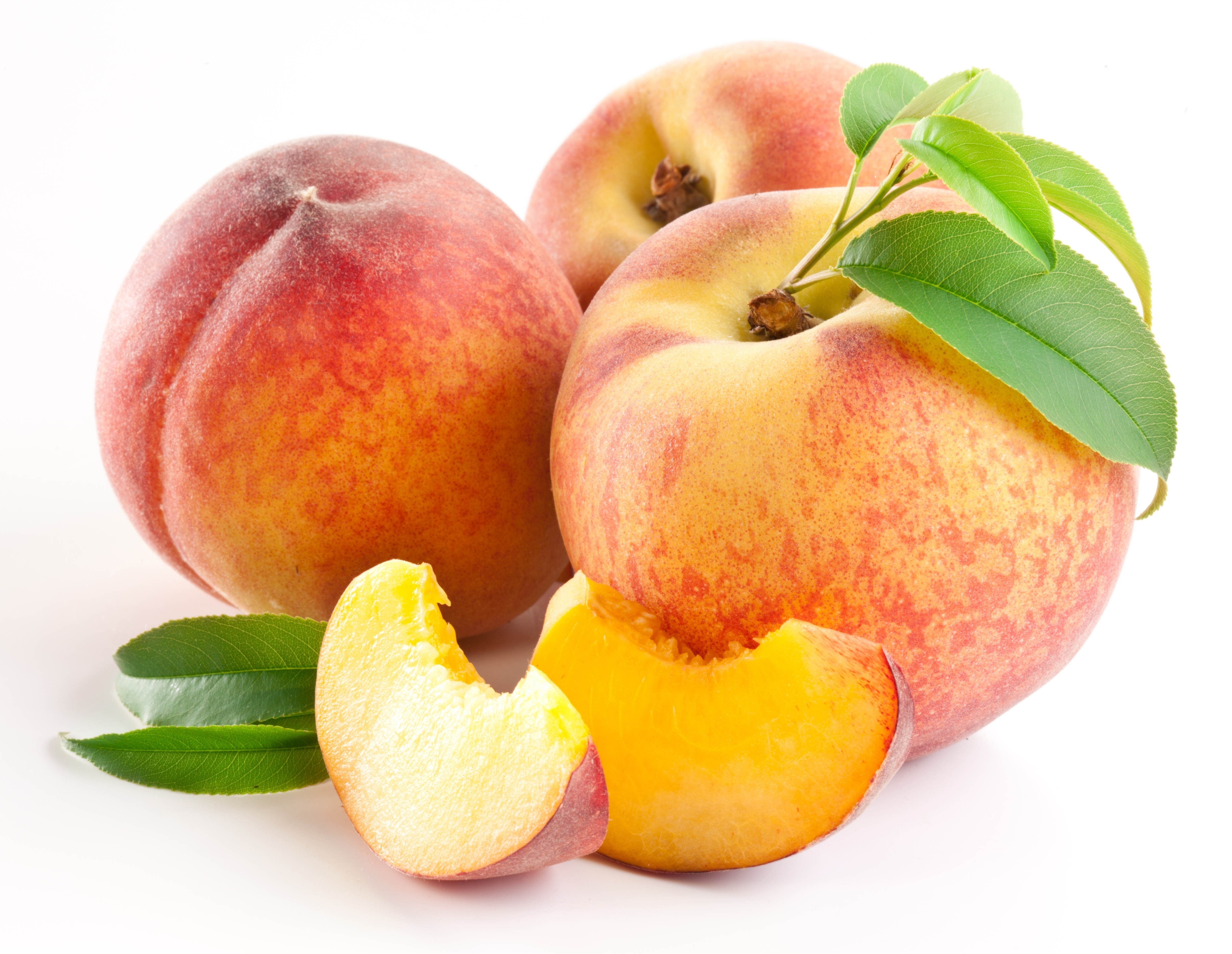 Fresh peaches with leaves