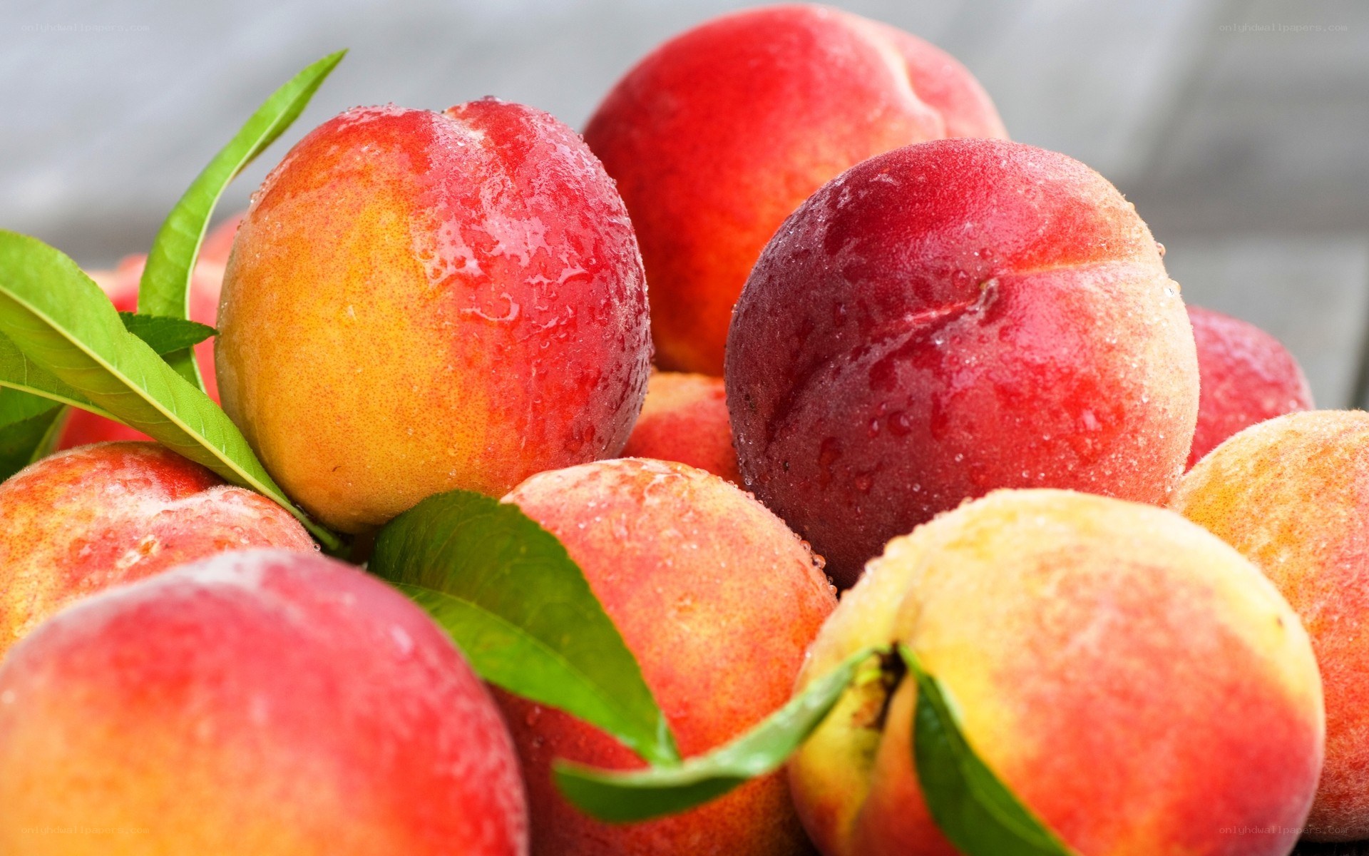 Fresh peaches with leaves