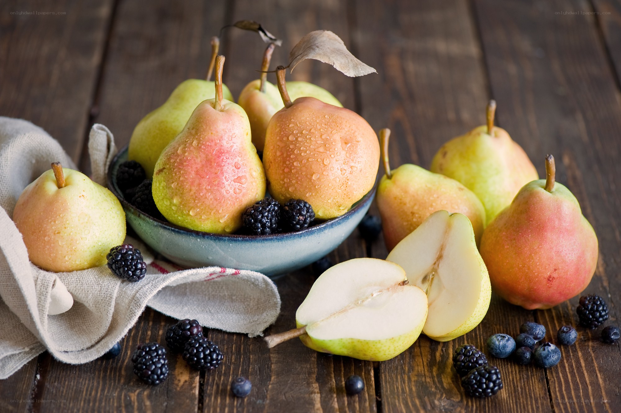 Fresh pears and berries on wood