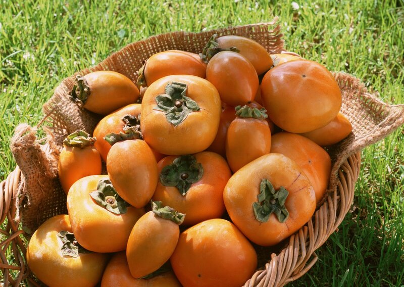 Fresh persimmons in a basket