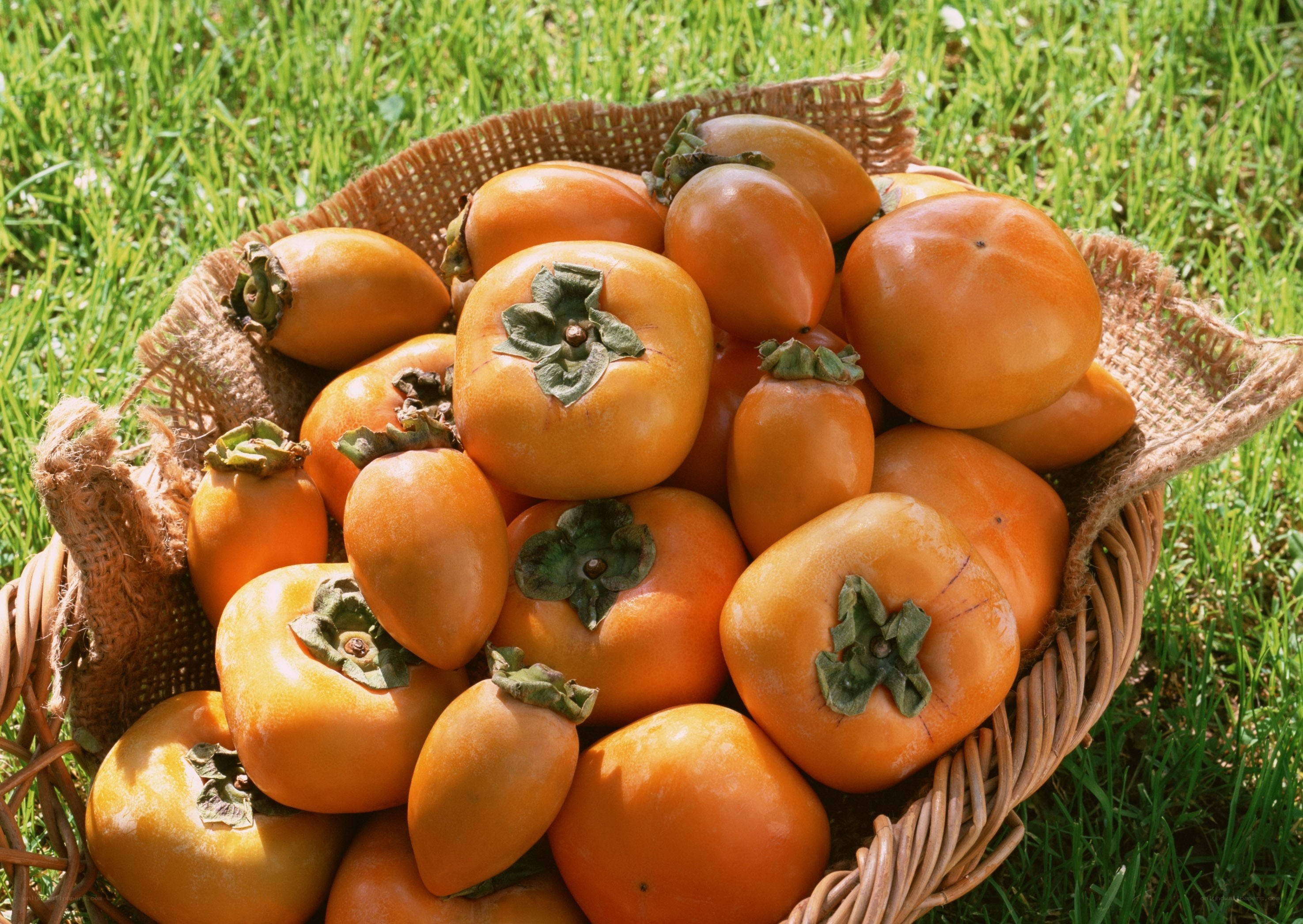 Fresh persimmons in a basket