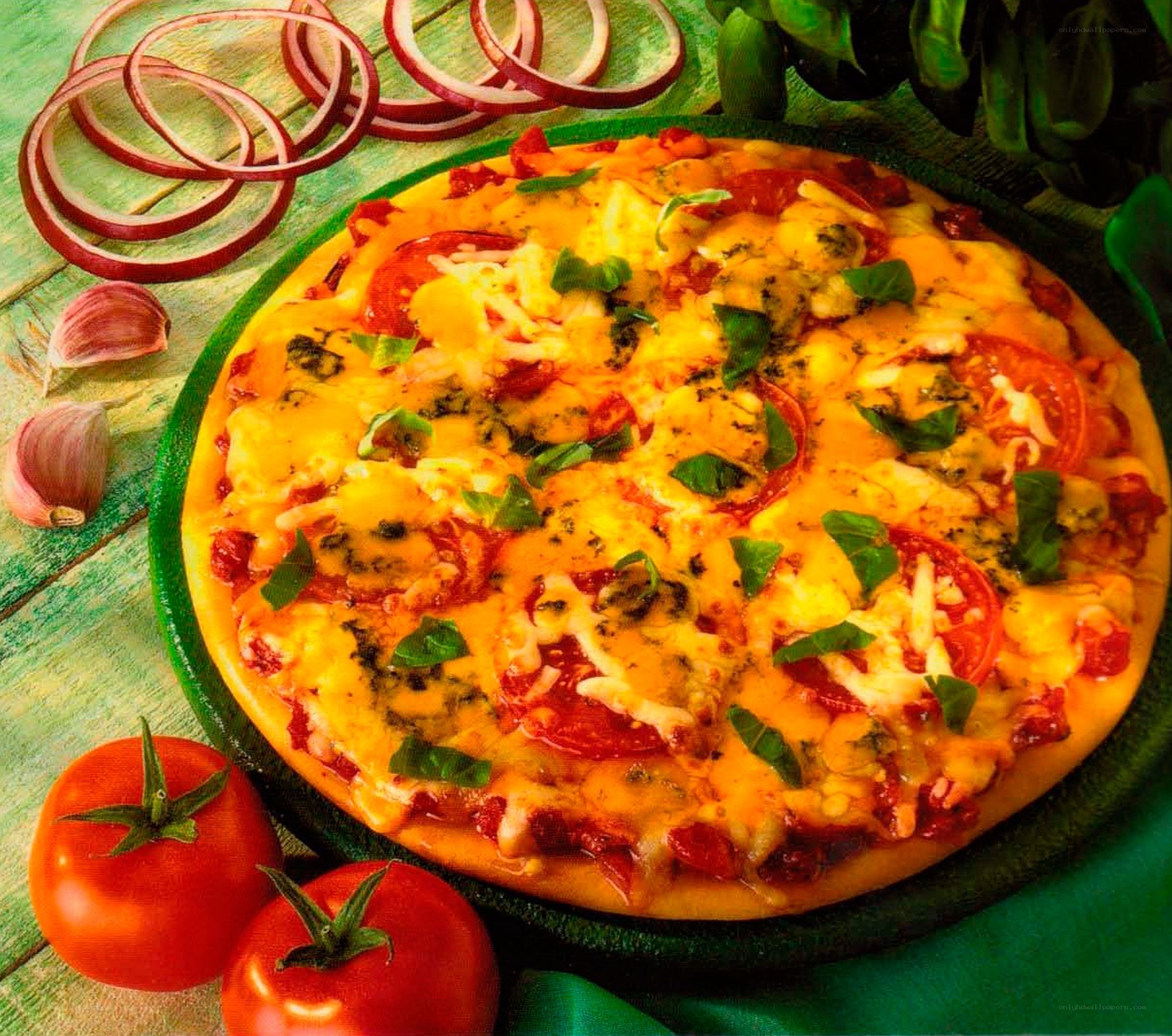 Fresh pizza with tomatoes and basil