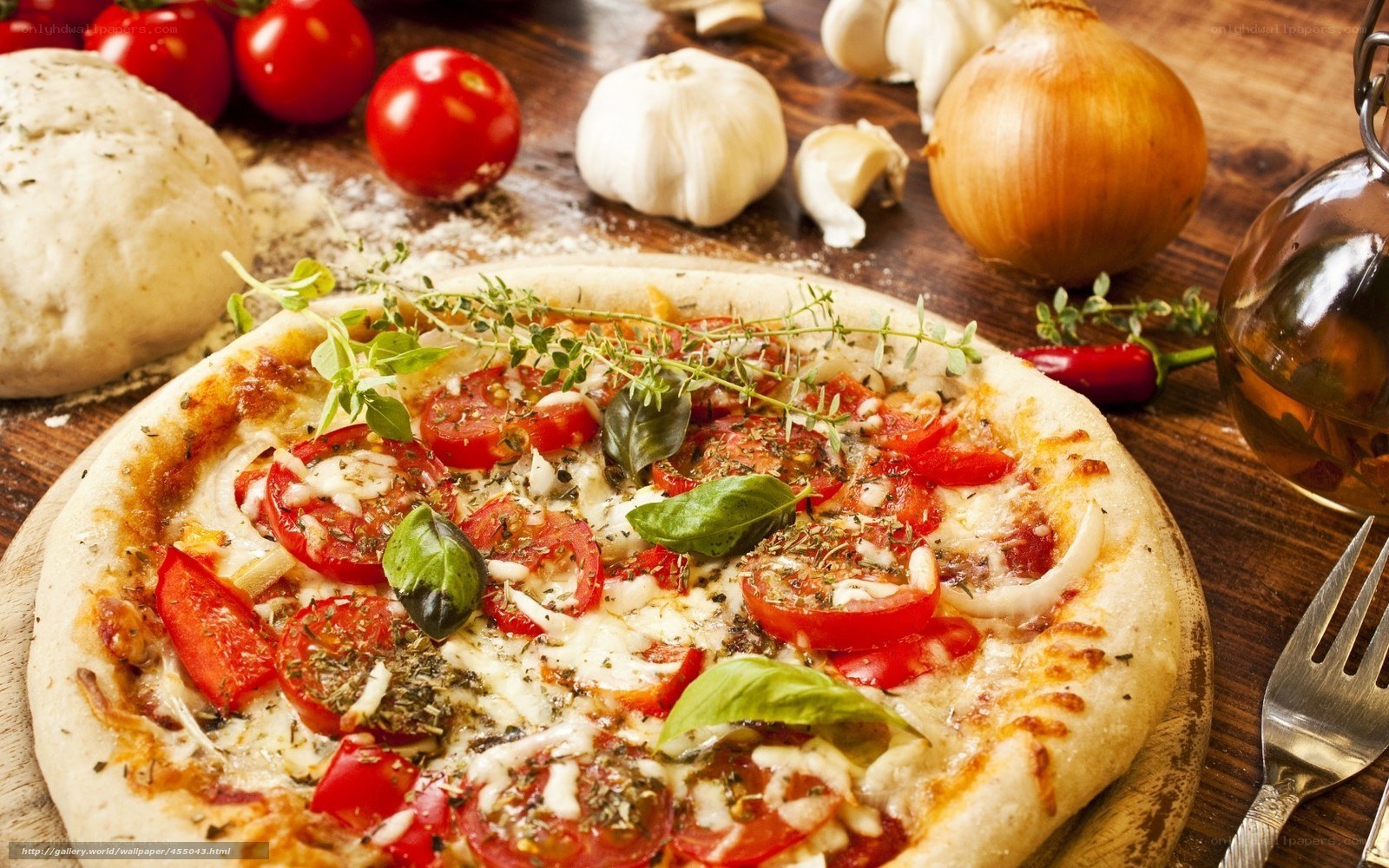 Fresh pizza with tomatoes and herbs