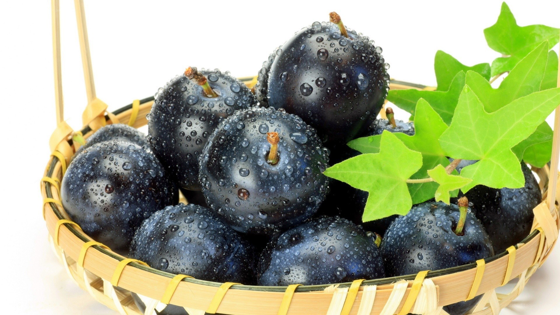 Fresh plums in a basket