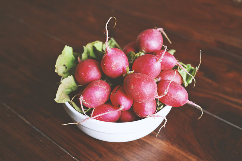 Fresh radishes in a bowl