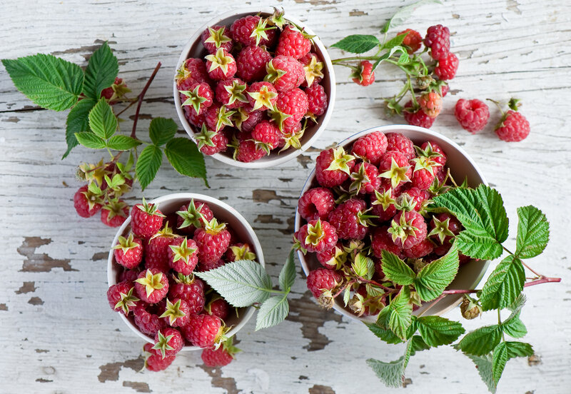 Fresh raspberries in bowls