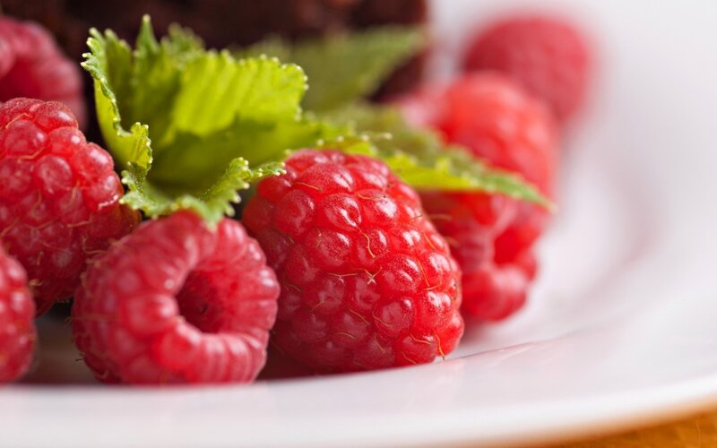 Fresh Raspberries on Plate — Red
