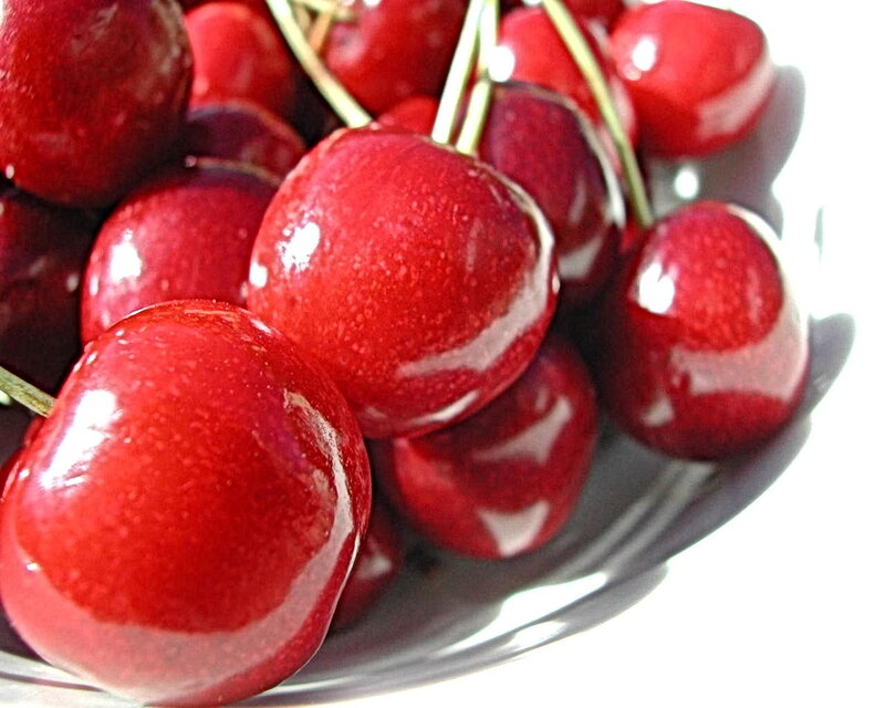Fresh red cherries in a bowl