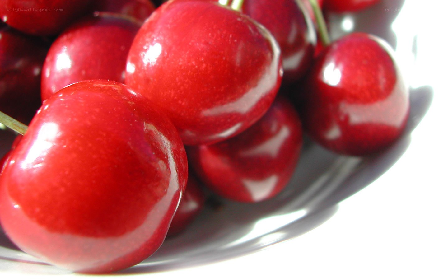 Fresh red cherries in a bowl