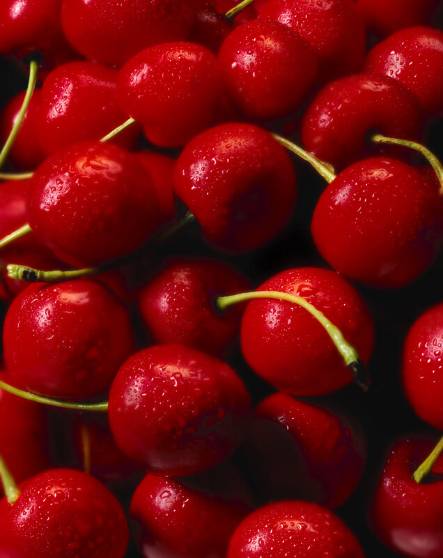Fresh red cherries with water droplets