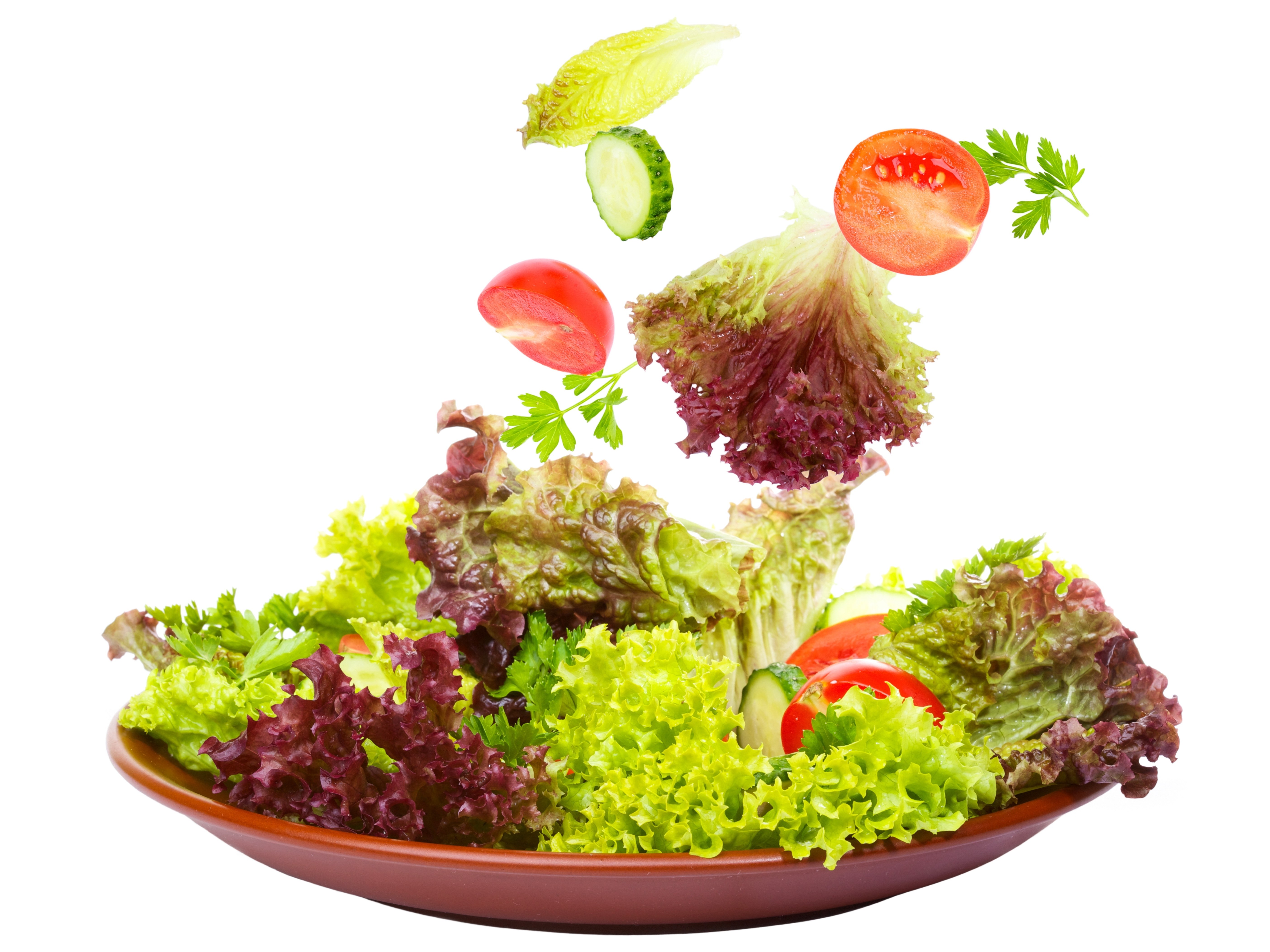 fresh salad ingredients in motion