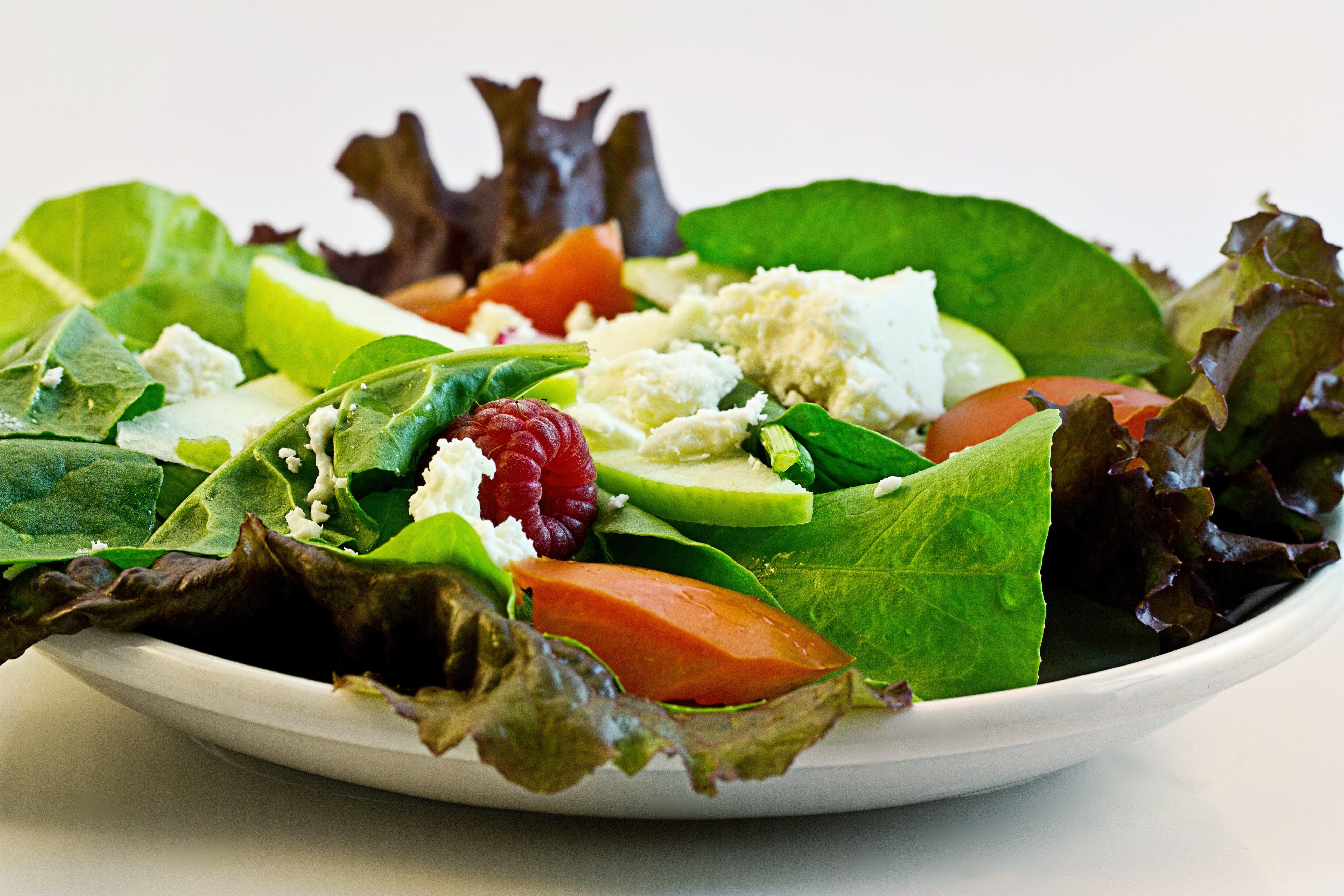 Fresh salad with berries and cheese