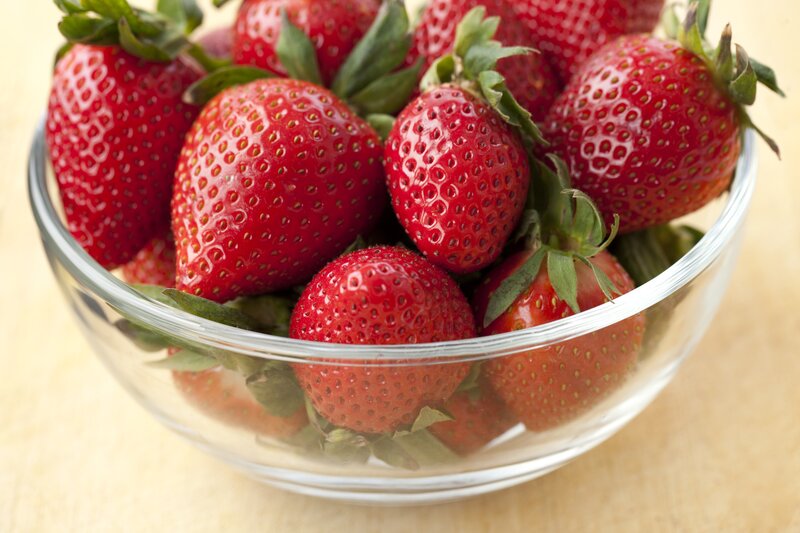 Fresh strawberries in a glass bowl