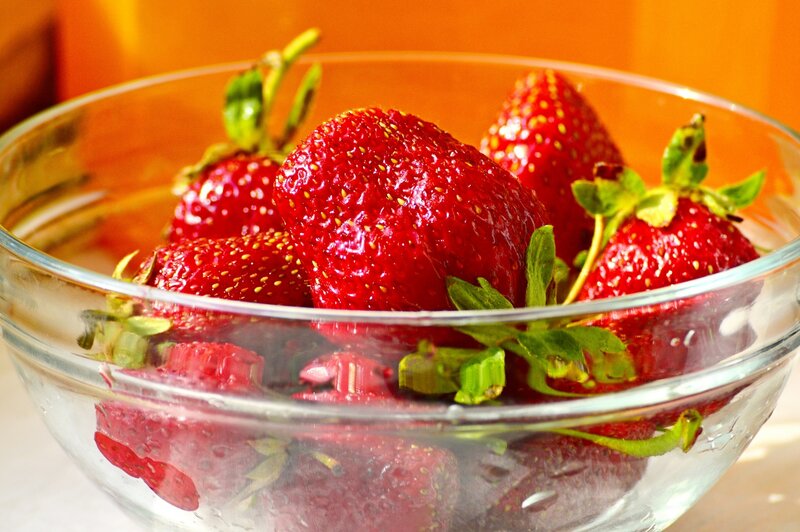 Fresh strawberries in a glass bowl