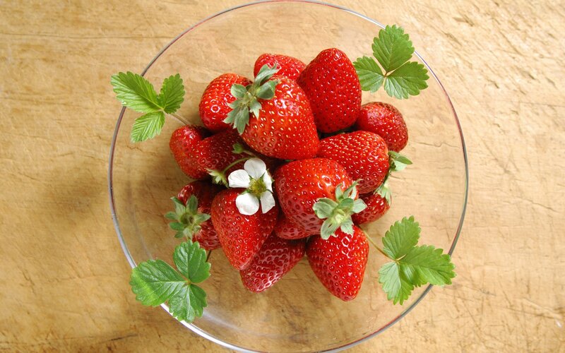 Fresh strawberries in a glass bowl