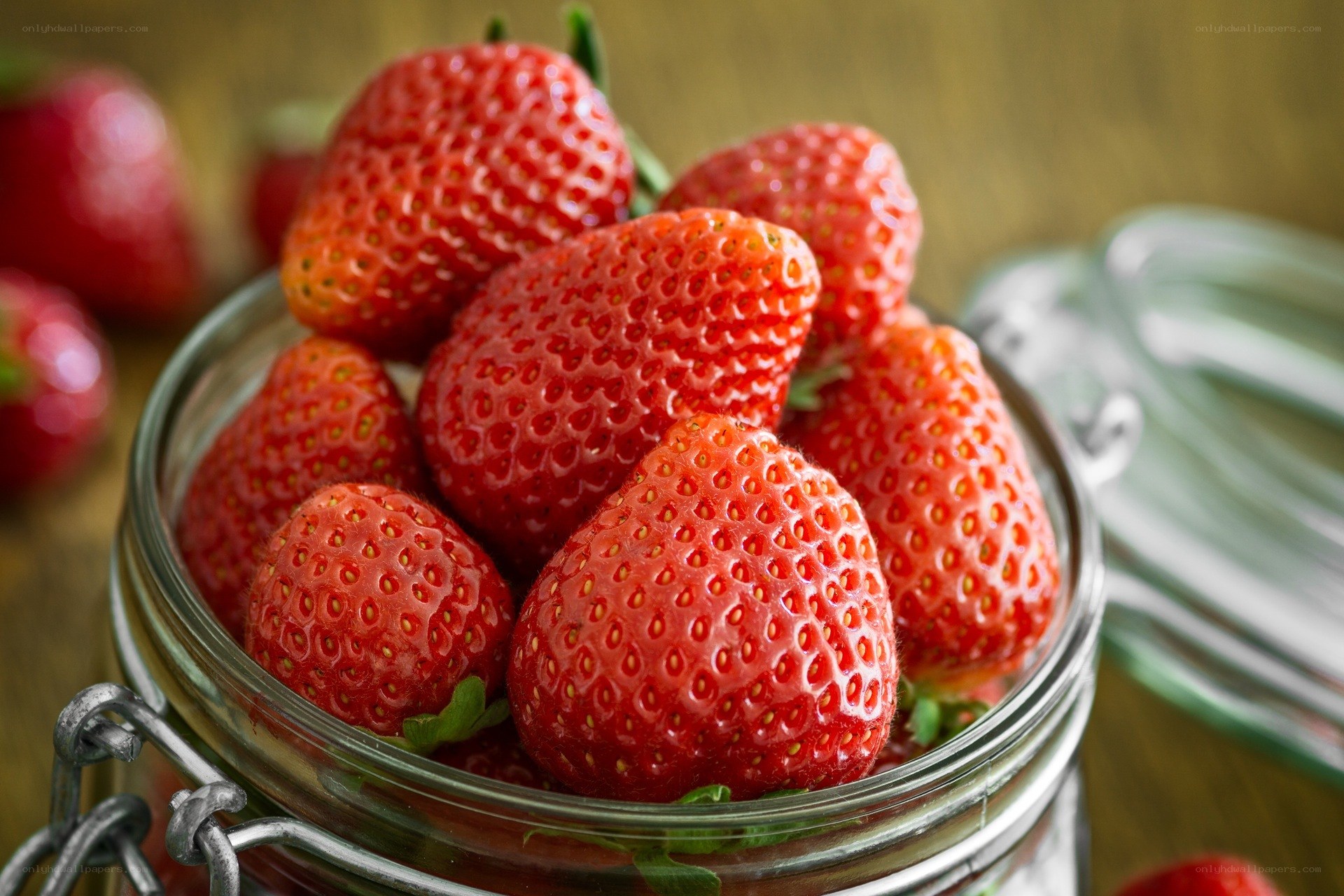 Fresh strawberries in a jar