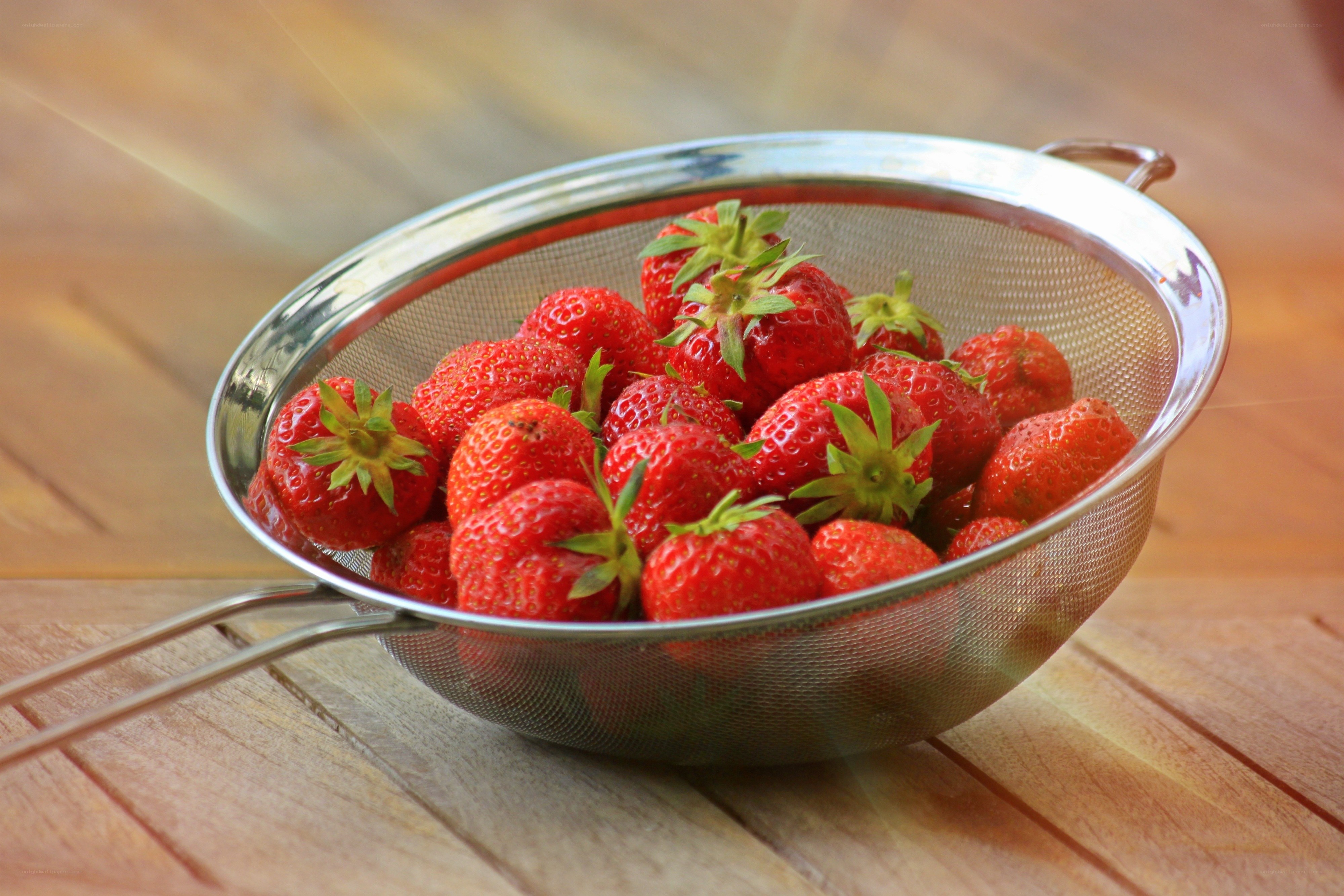 Fresh strawberries in a strainer