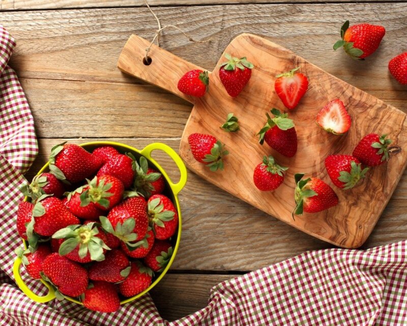 Fresh strawberries on a wooden table