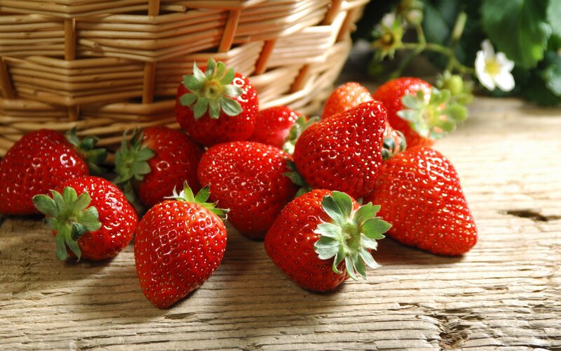 Fresh strawberries on wood