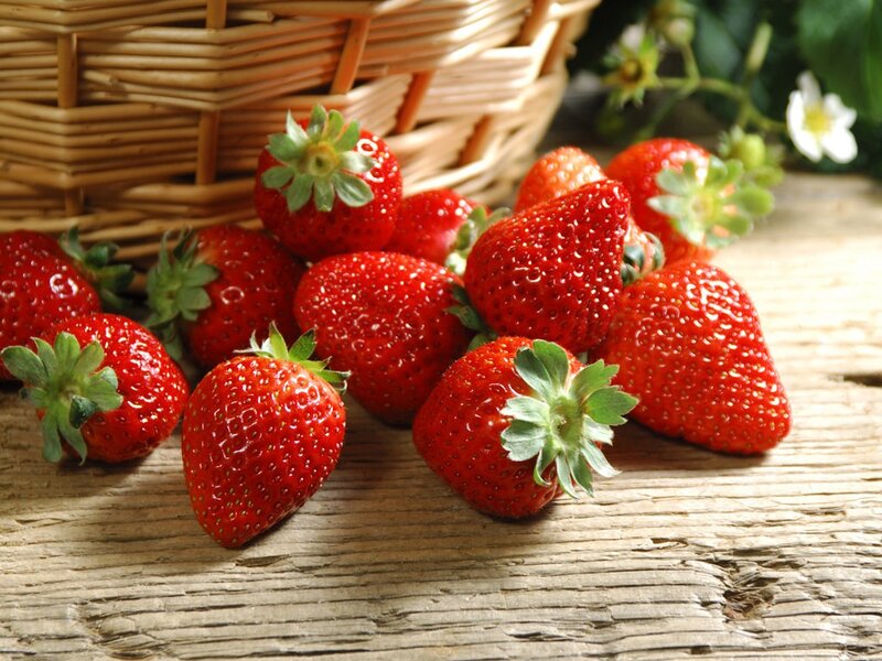 Fresh strawberries on wooden table