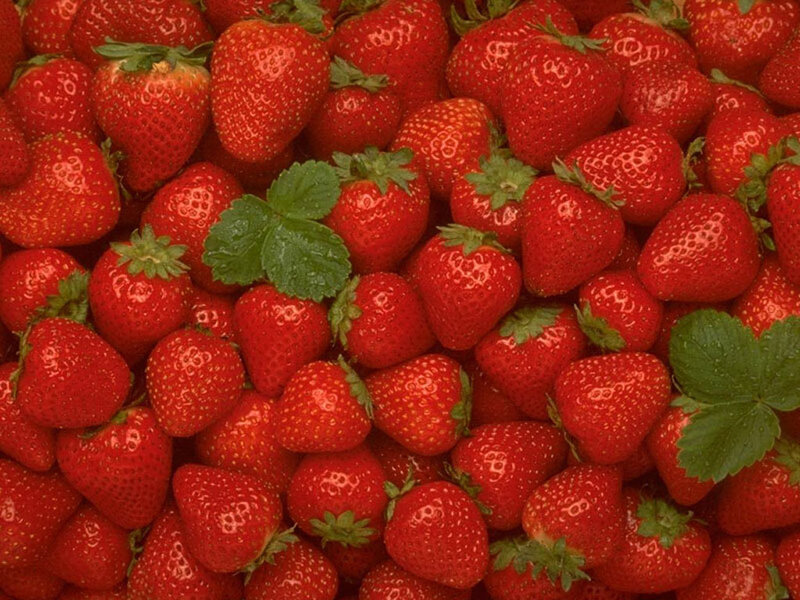 Fresh strawberries with green leaves