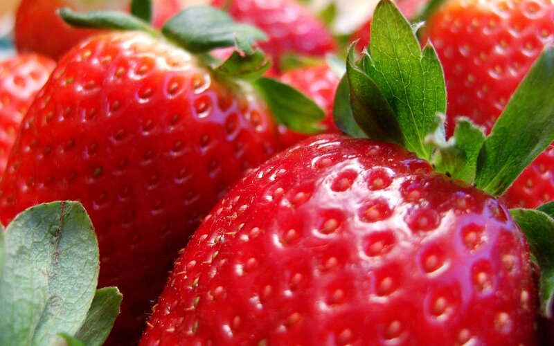 Fresh strawberries with green leaves
