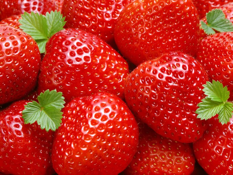 Fresh strawberries with green leaves
