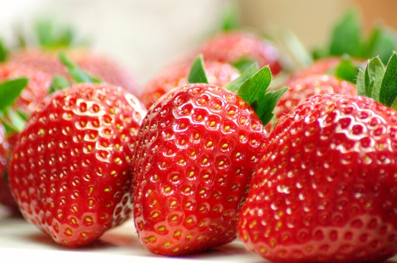 Fresh strawberries with green leaves