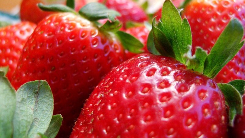 Fresh strawberries with green leaves
