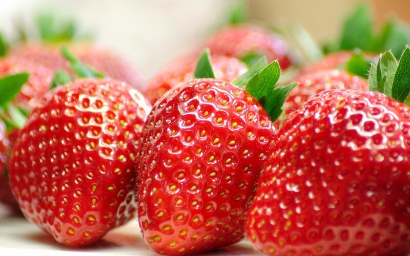 Fresh strawberries with green leaves