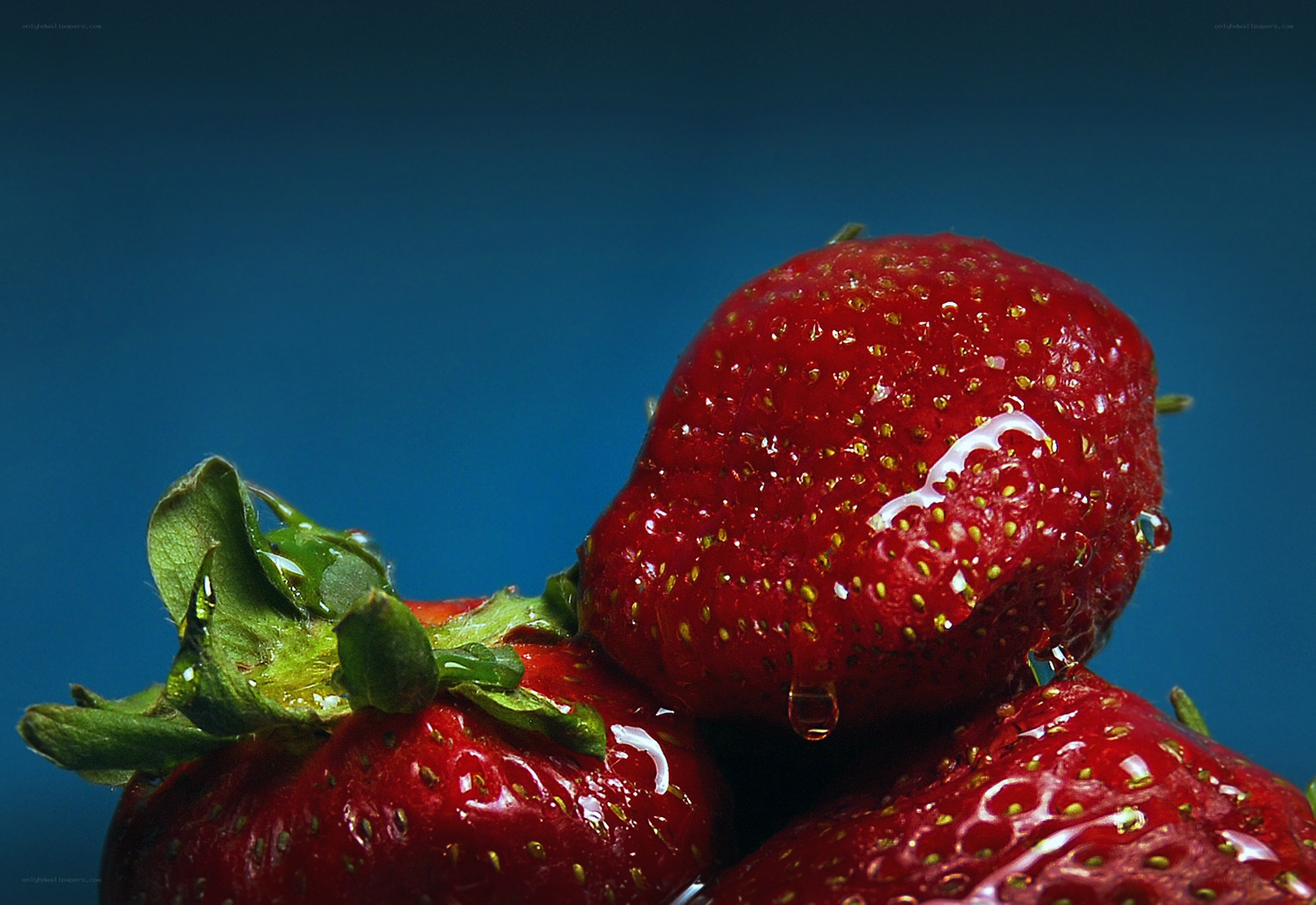 Fresh strawberries with water droplets