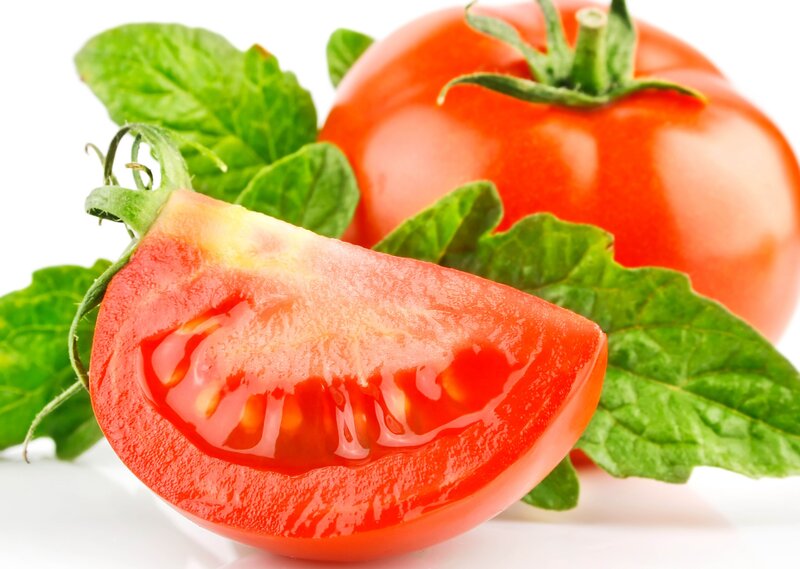 fresh tomato with basil leaves