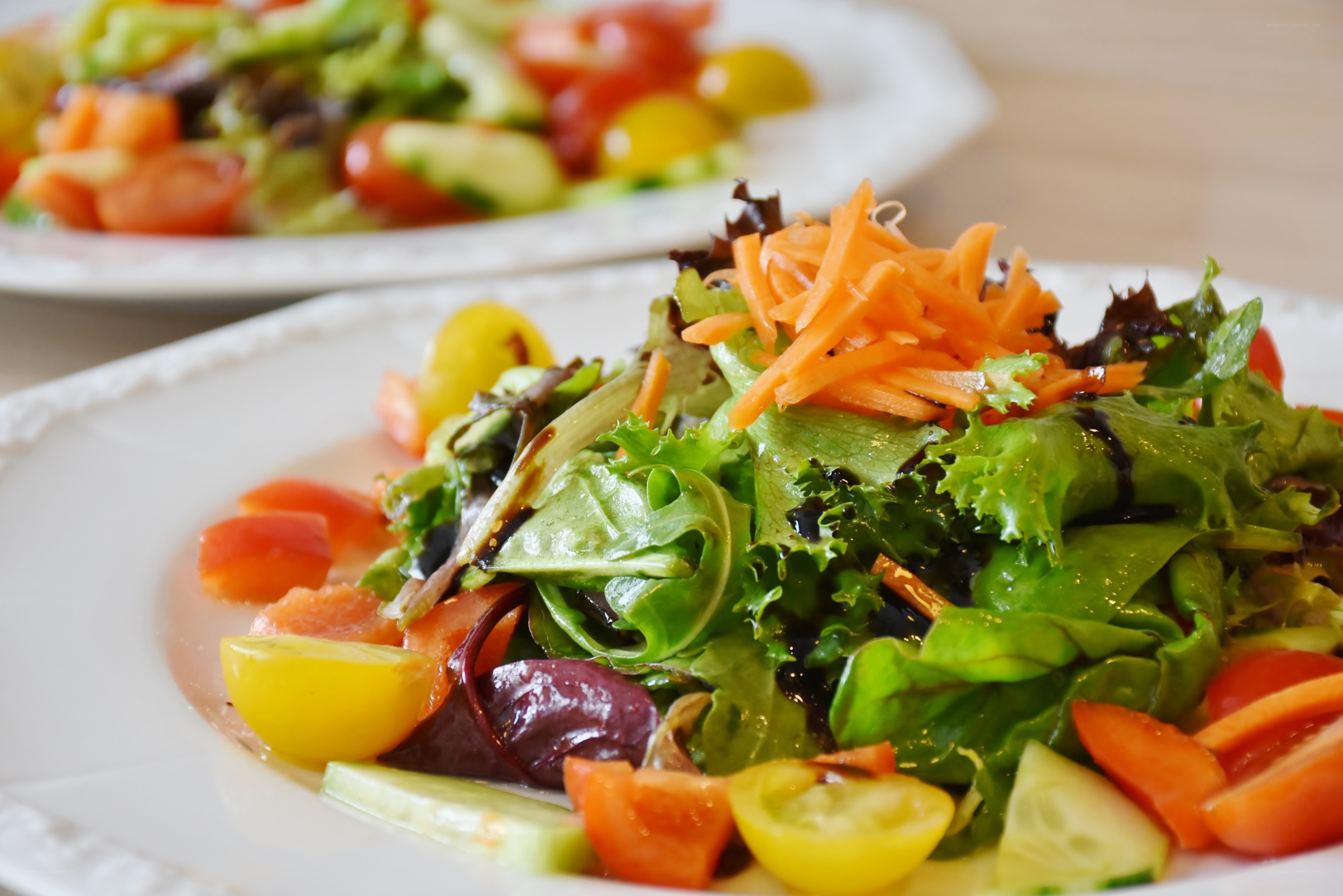 Fresh vegetable salad on white plate