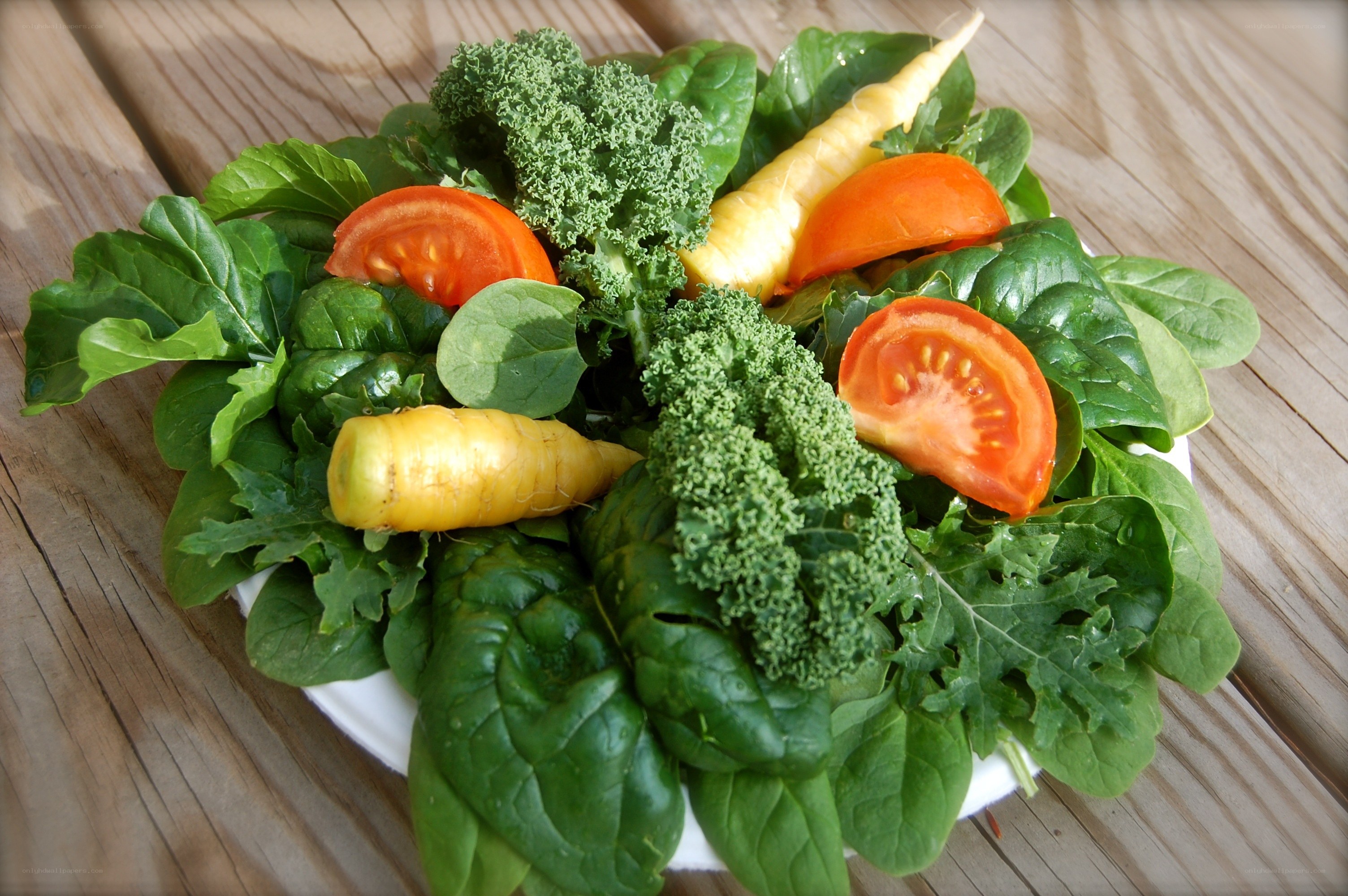 fresh vegetable salad on wood
