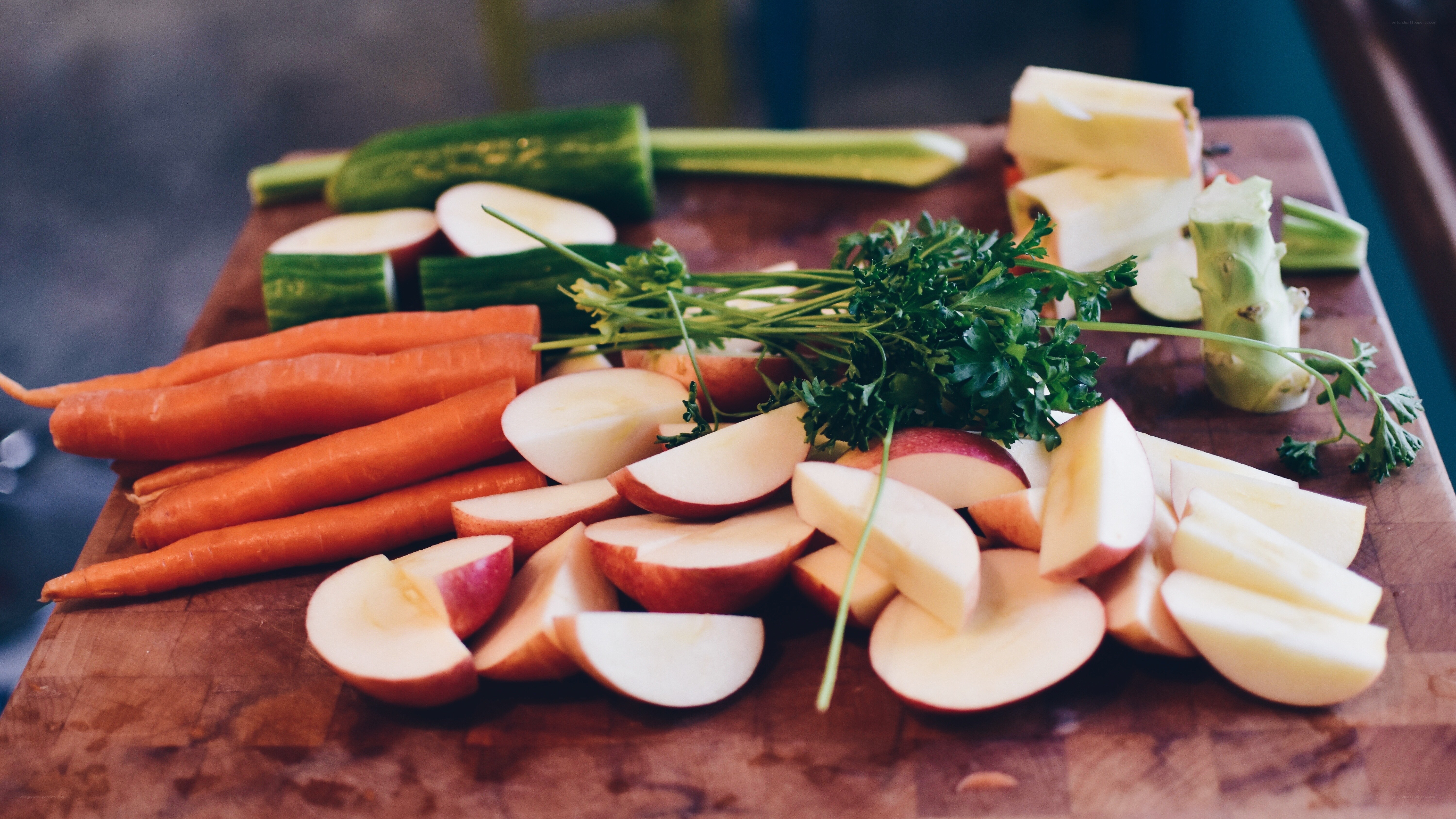 Fresh vegetables and fruit on a cutting board