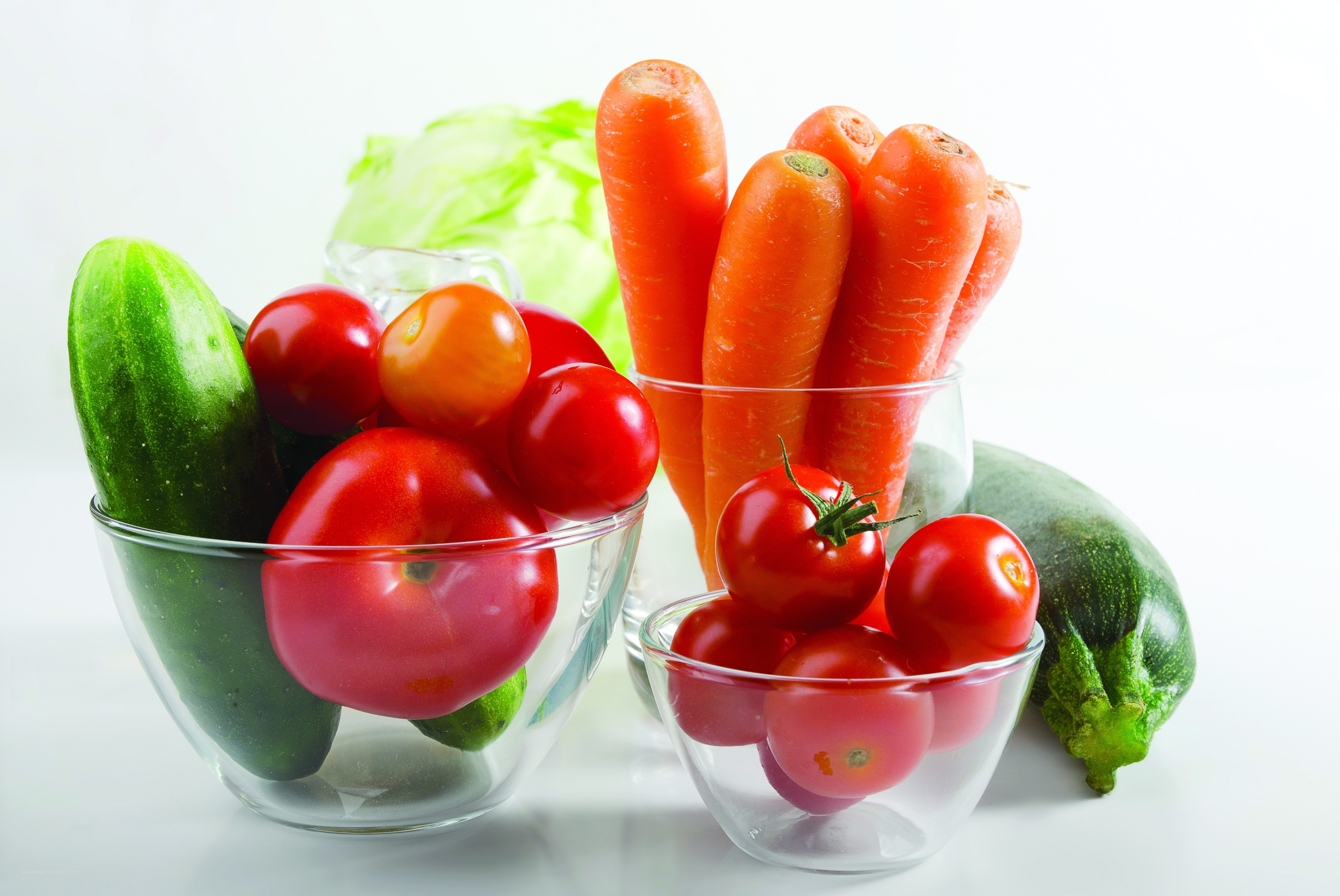 Fresh vegetables in glass bowls